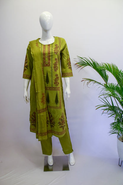 Green embroidered outfit on a mannequin with a white background