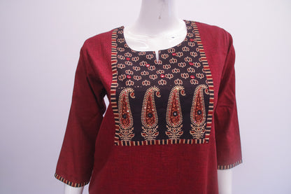 Maroon kurta with intricate gold and red embroidery on a mannequin against a white background