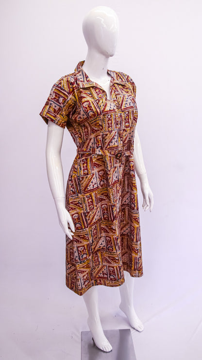 Mannequin wearing a patterned dress on a white background