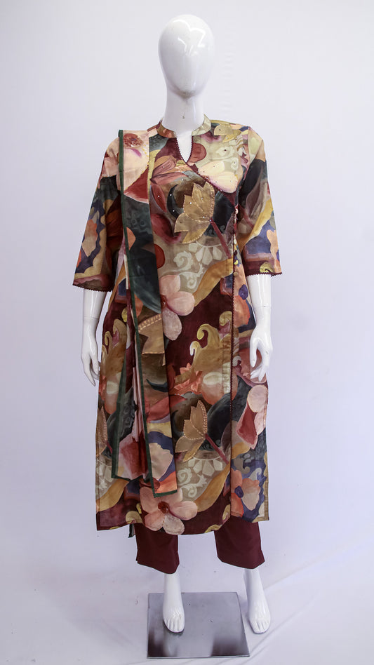 Mannequin wearing a colorful floral dress on a white background