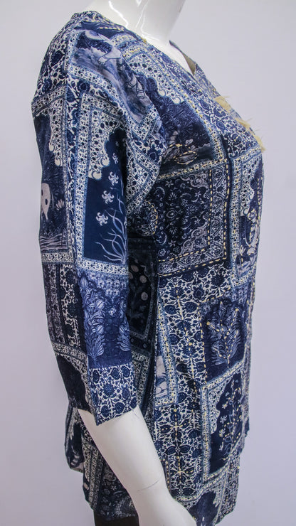 Mannequin wearing a blue patterned dress against a white background