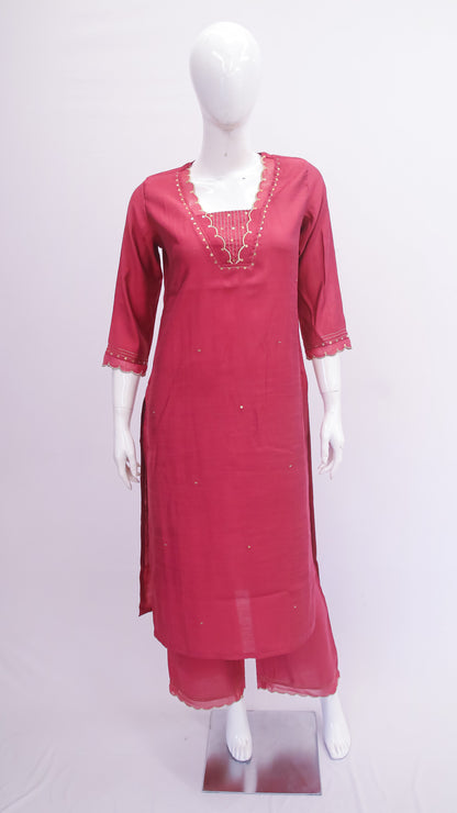 Red kurta on a mannequin against a white background