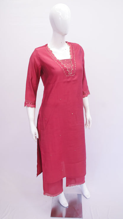 Red kurta on a mannequin against a white background