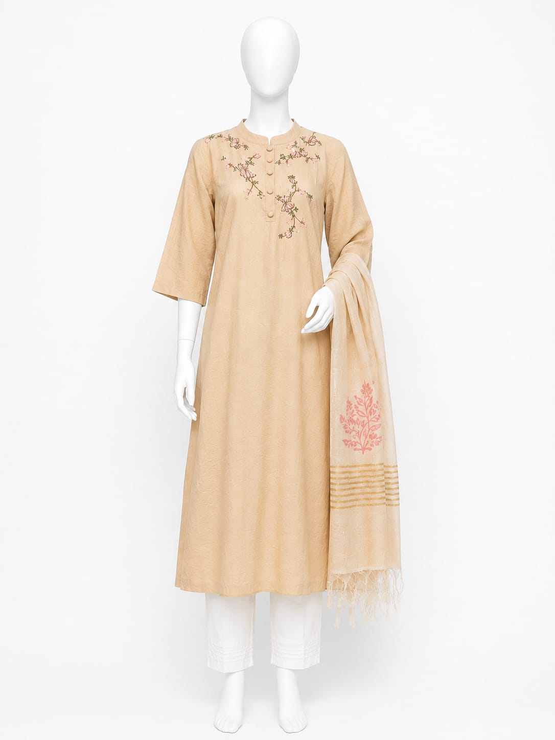 Beige dress with floral embroidery on a mannequin against a white background