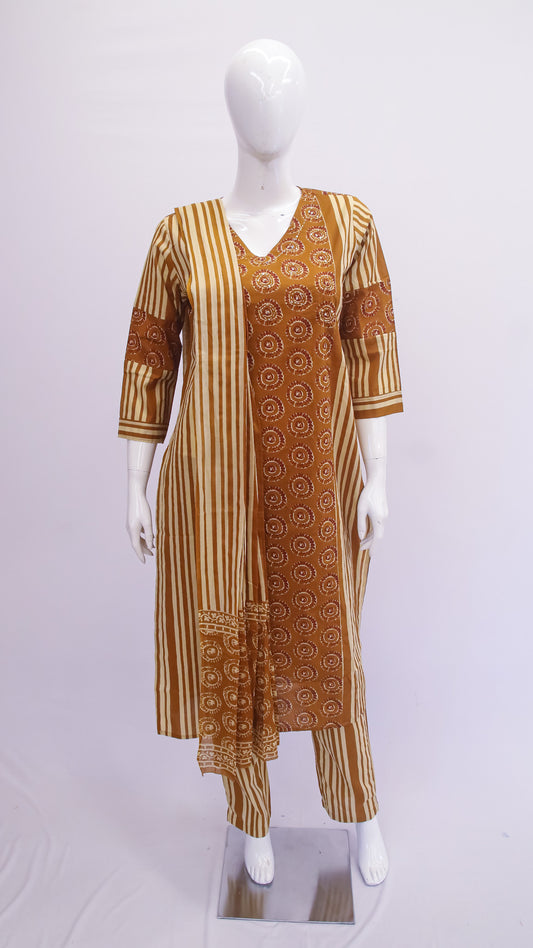 Mannequin wearing a brown and beige patterned dress on a white background