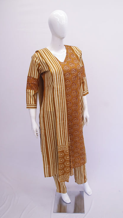 Mannequin wearing a brown and beige patterned dress on a white background