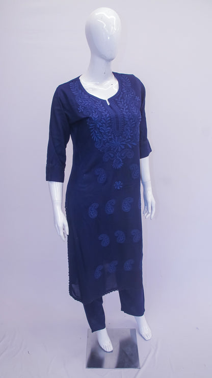 Navy blue dress with floral patterns on a mannequin against a light gray background