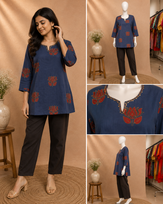 A woman models a navy blue kurta with red floral motifs and black cropped pants in a warm beige studio setting. The collage also includes mannequin views of the outfit, a close-up of the neckline embroidery, and a side view of the full outfit.