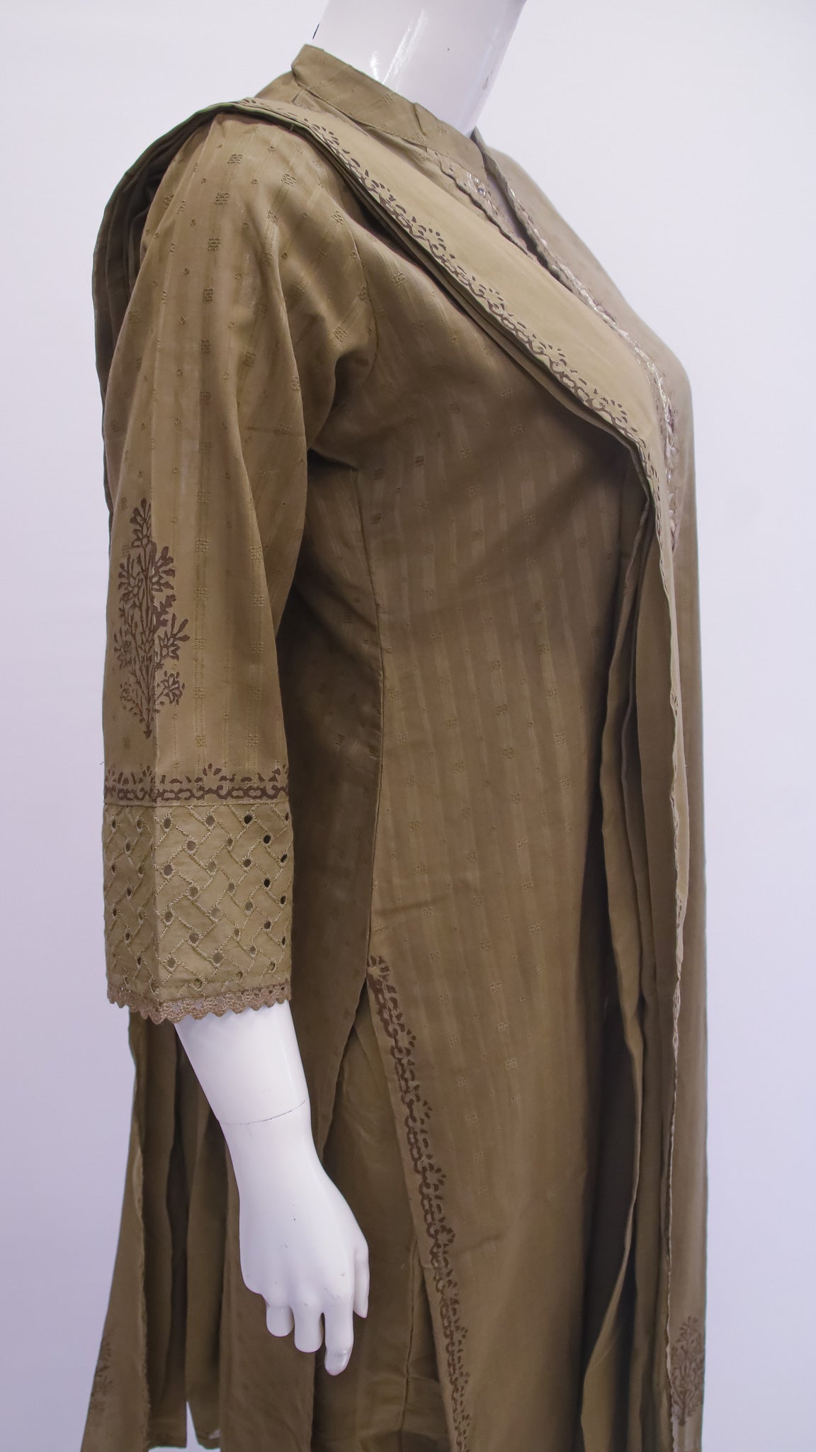 Brown dress with intricate patterns on a white background