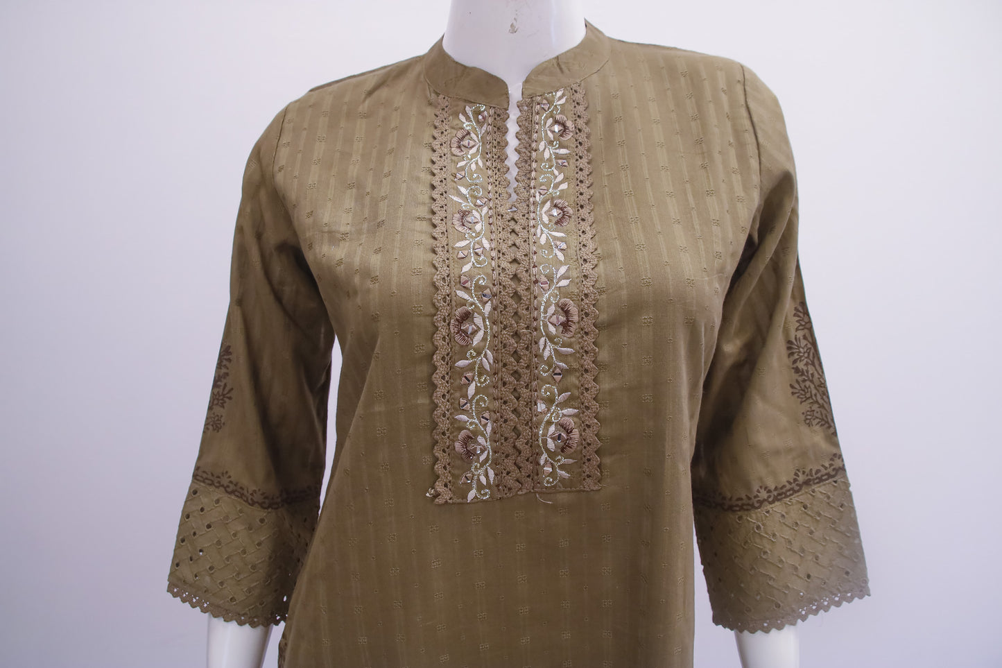 Brown embroidered kurta on a mannequin against a white background