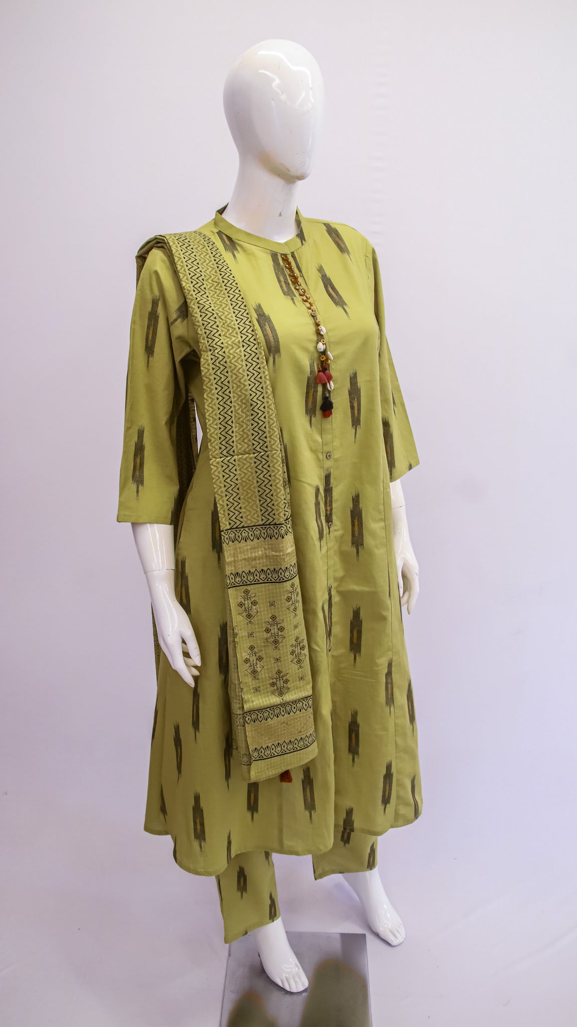 Green printed kurta with matching dupatta on a mannequin against a white background