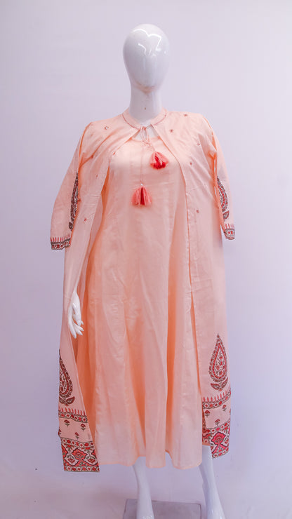 Mannequin wearing a peach-colored kurta with red embroidery on a white background