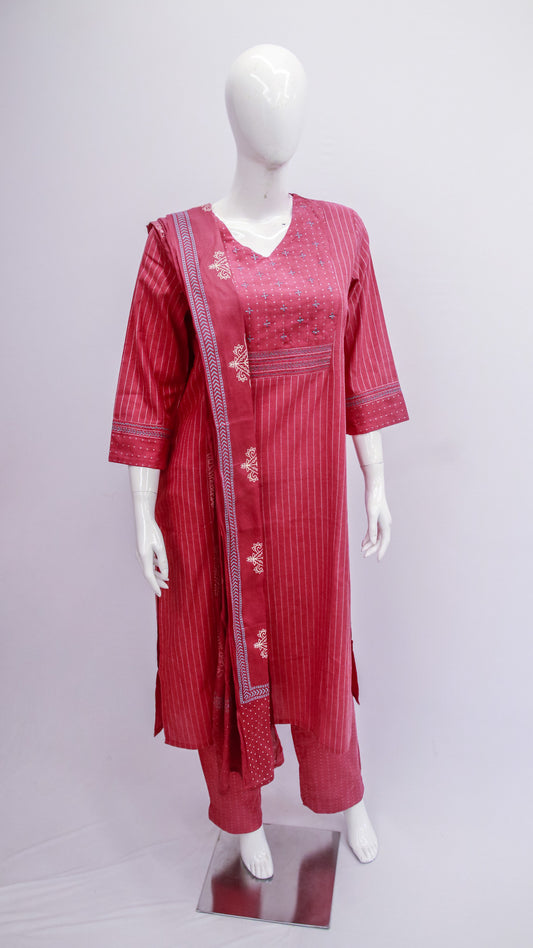 Red traditional outfit with white embroidery on a mannequin against a light gray background