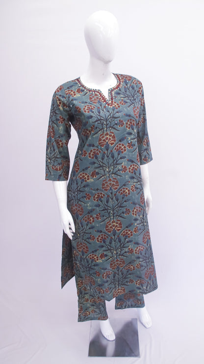 Floral patterned dress on a mannequin against a white background