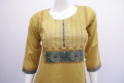 Yellow kurta with blue embroidery on a mannequin against a white background