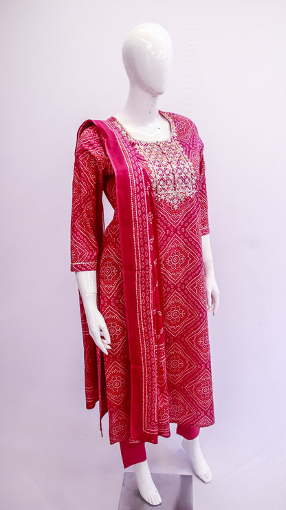 Red patterned dress with matching dupatta on a mannequin against a white background