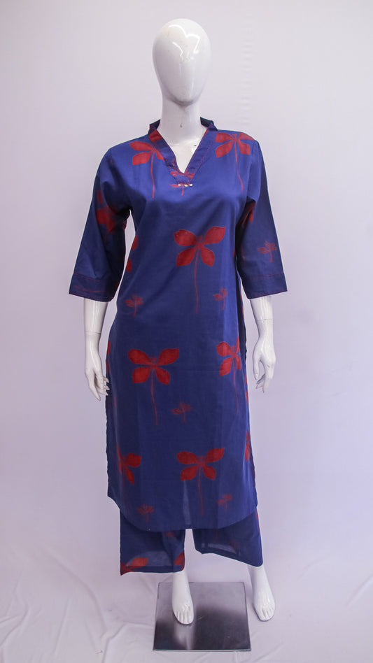Blue dress with red patterns on a mannequin against a white background