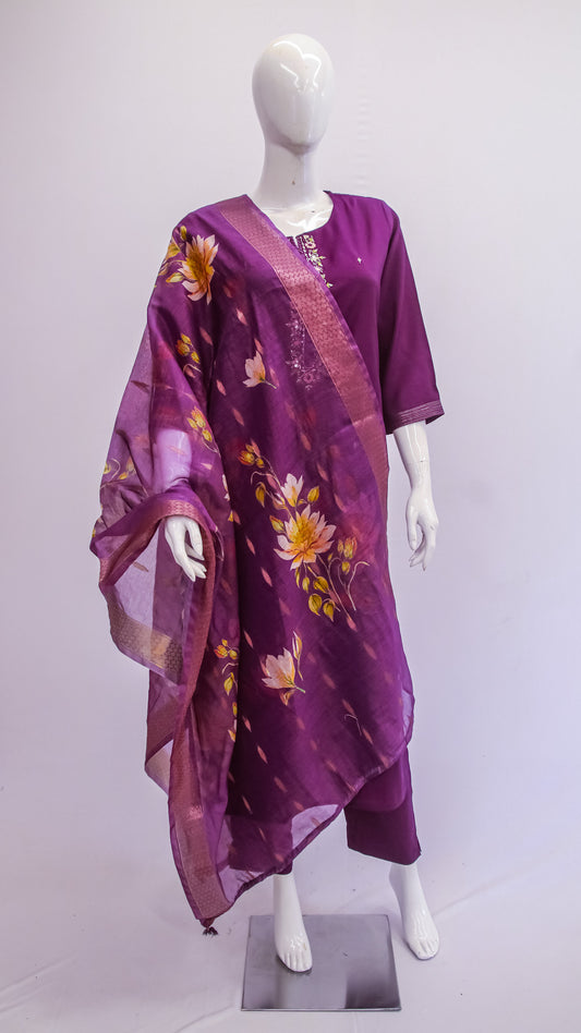 Purple outfit with floral patterns on a mannequin against a white background