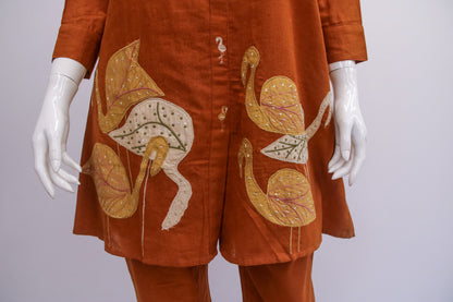 Brown outfit with floral patterns on a white background