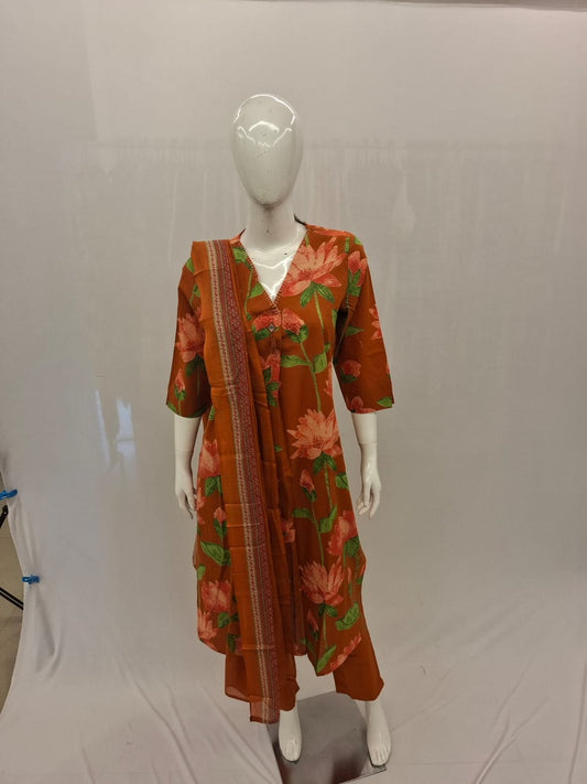 Mannequin wearing a red floral dress on a gray background