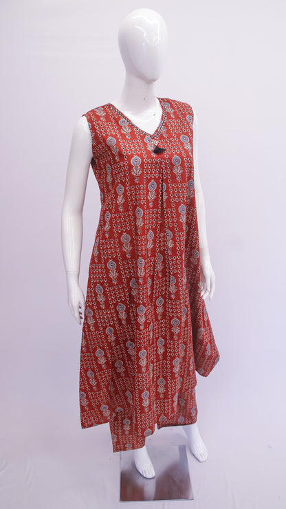 Red patterned dress on a white mannequin against a white background