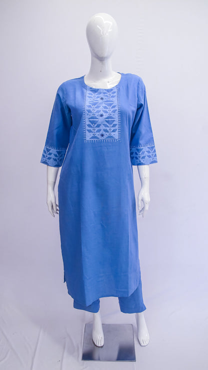 Blue embroidered dress on a mannequin against a white background