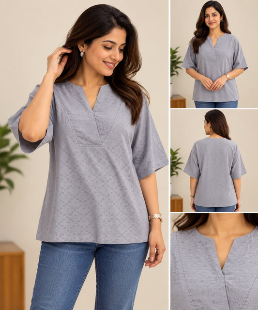 Close-up of a light grey Rayon short top with textured geometric pattern and V-notch neckline