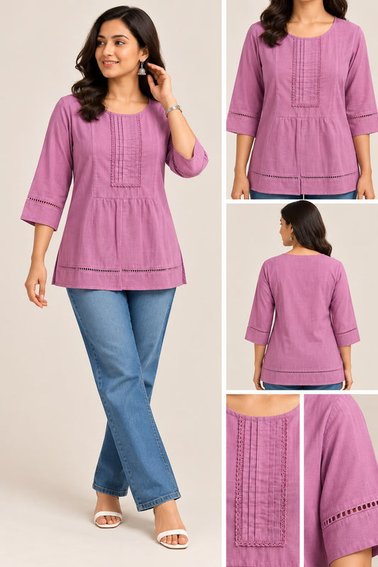Close-up of a mauve pink cotton short top featuring a round neckline, pleated front panel, delicate lace trim, and three-quarter sleeves with cutwork detailing.