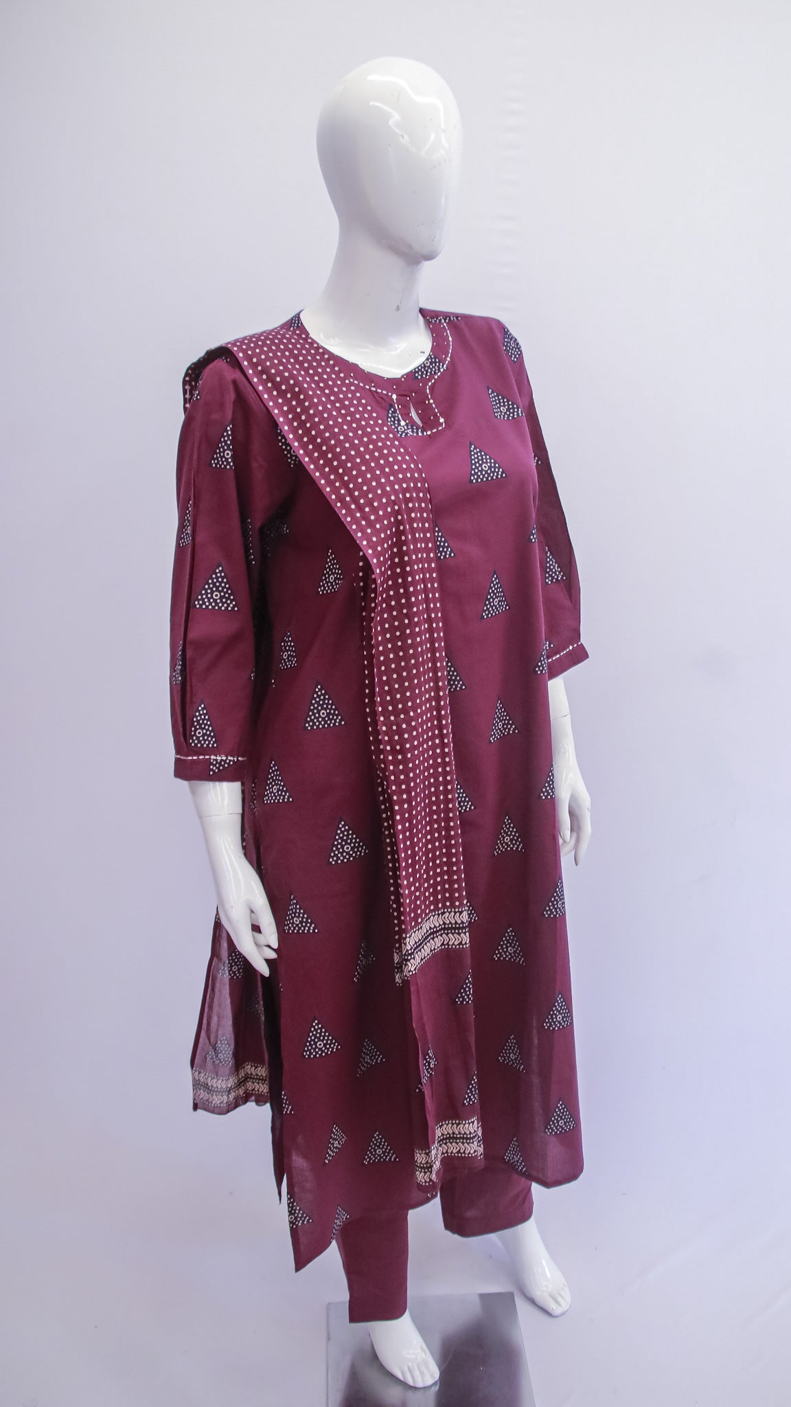 Maroon traditional outfit with matching dupatta on a mannequin against a white background